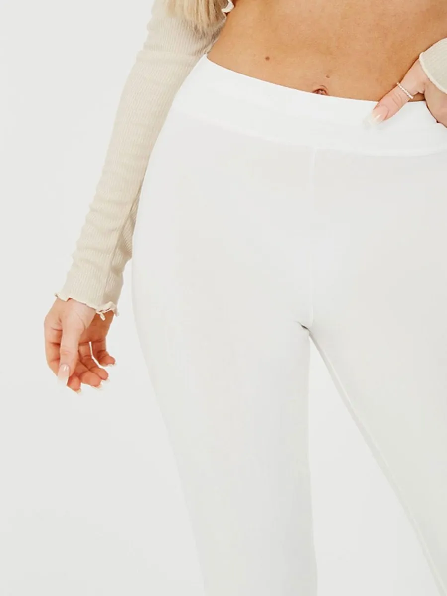 Stevie Scrunch Back Flared Slinky Trousers In Cream