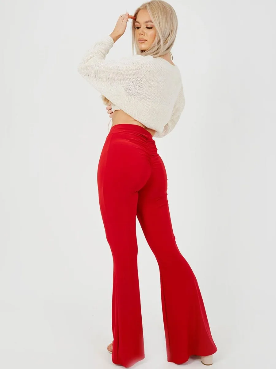 Stevie Scrunch Back Flared Slinky Trousers In Red